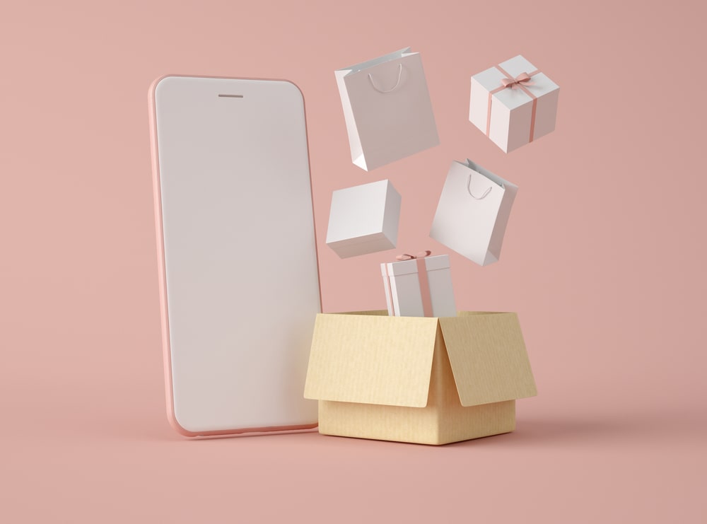 celular ao lado de caixas em ilustração para ilustrar texto sobre estratégias para vender no instagram